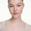 Una Angelic-halsband med rundslipade, dubbelsidiga motiv, vitt, rodiumpläterat